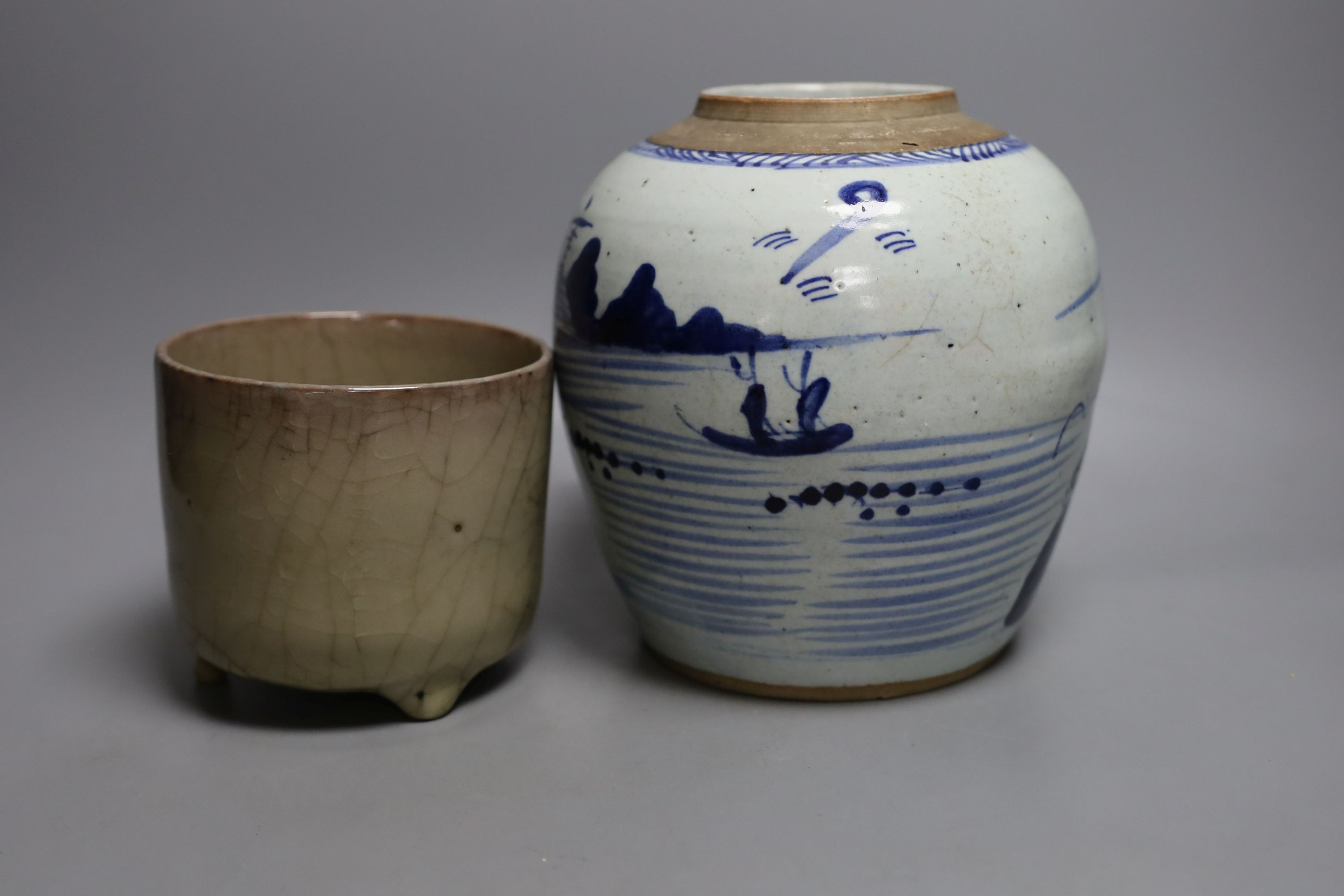 A 19th century Chinese blue and white jar depicting a village scene, together with a Chinese crackle glaze tripod censer - tallest 19cm
